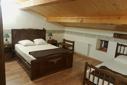 Lit de la chambre du gite ozon07